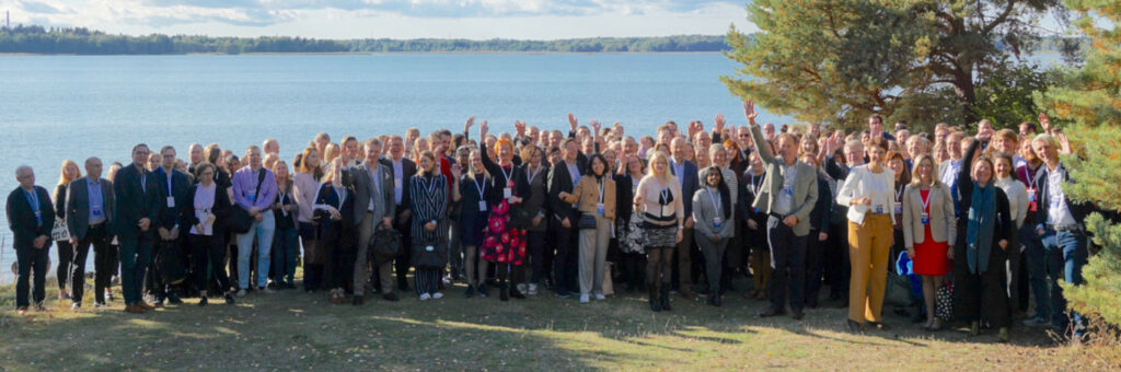 A group photo of the Mission: Possible symposium participants at Kalastajatorpa beach on 22 September 2022.