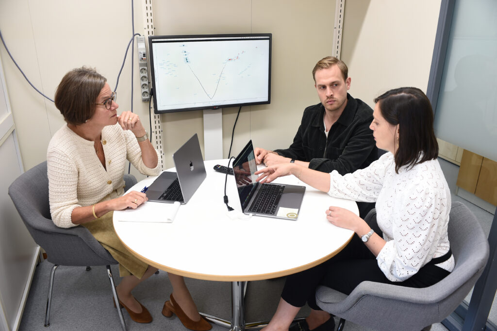 Professor Satu Mustjoki (left), Postdoctoral Fellow Olli Dufva and Postdoctoral Researcher Sara Gandolfi checking the results of CRISPR analysis in which genetic scissors are used to silence one gene per leukaemia cell at a time to examine how this particular gene affects the sensitivity of leukaemia cells to NK cell killing.