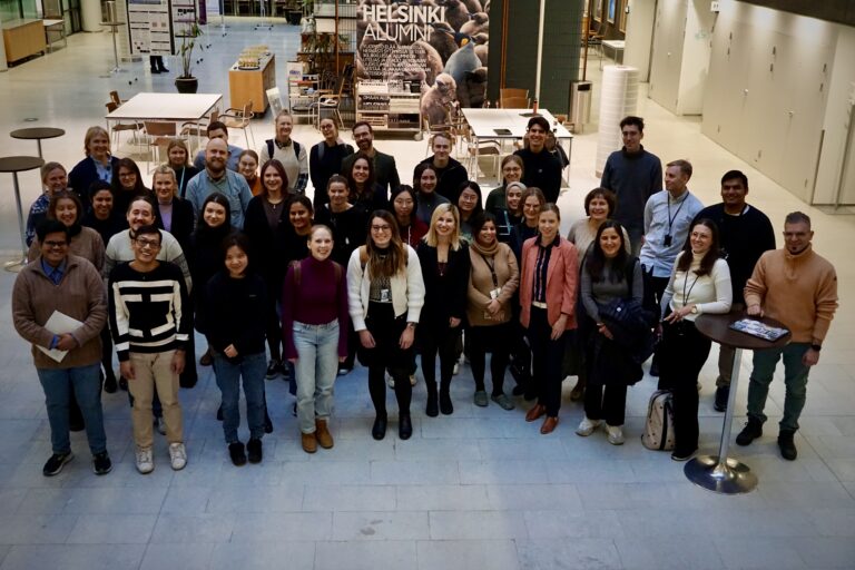 Group photo of people in a lobby